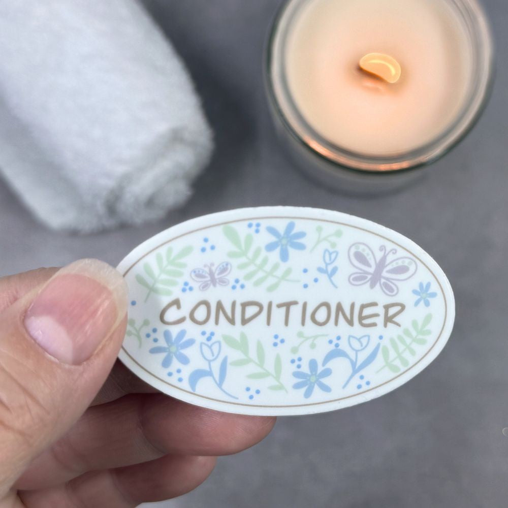 pastel garden doodle Conditioner sticker held in hand